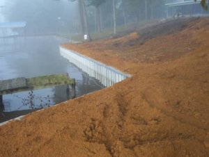 durable, dependable aluminum seawall just after its finished with straw on ground